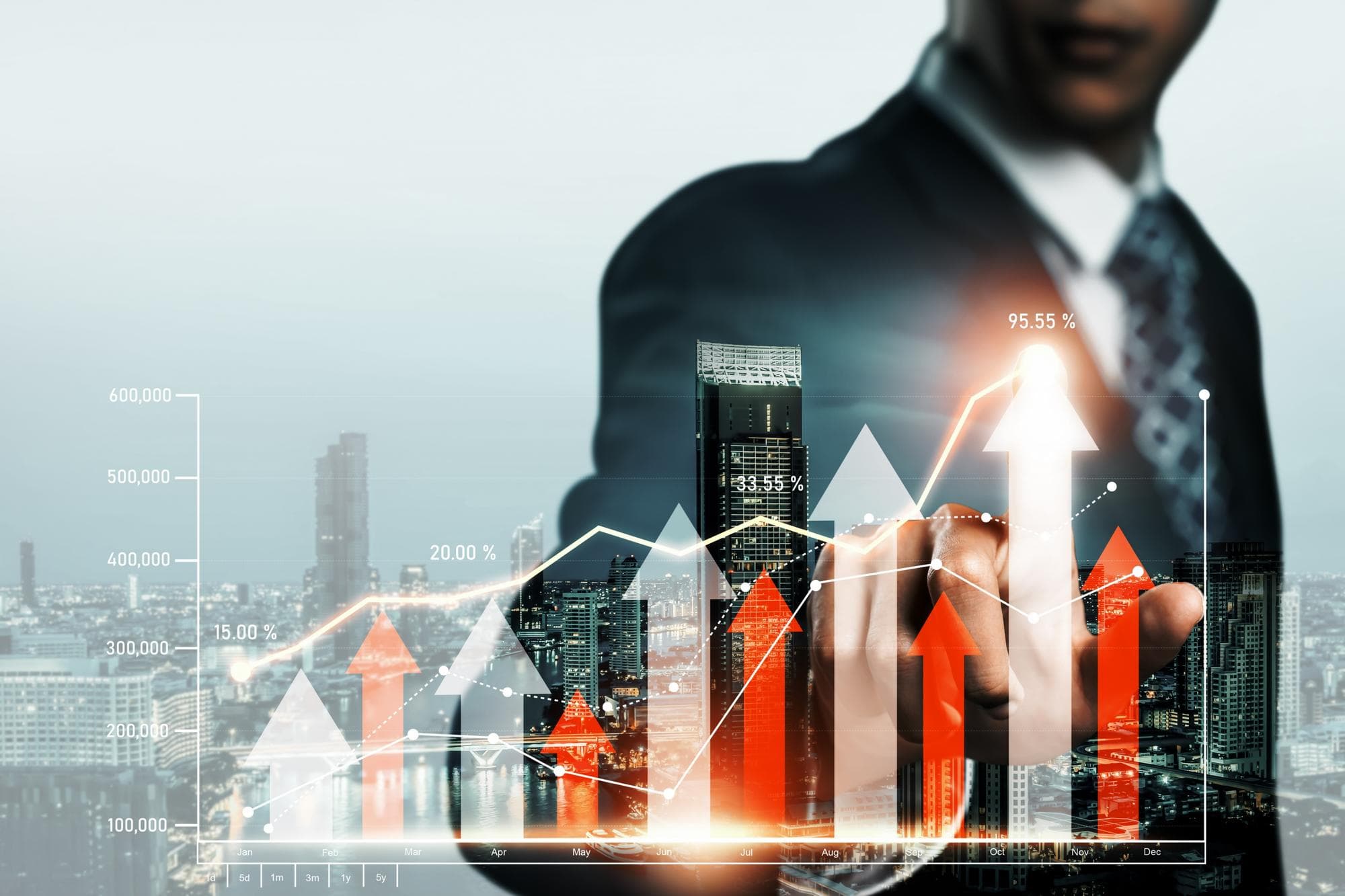 Businessman with investment growth chart overlay on city skyline